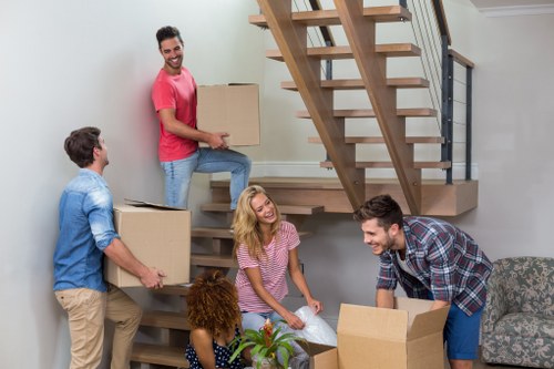 Office removals planning in Chiswick with moving boxes and workspace setup