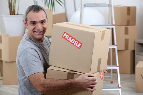 Professional team planning flat removals in Chiswick near a residential building