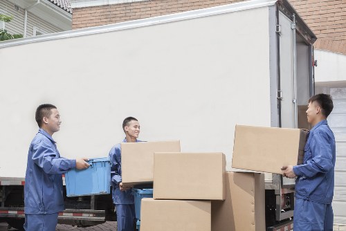 Professional house removalists loading furniture in Chiswick