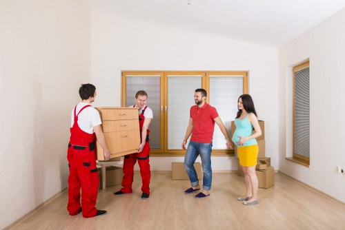 Professional movers loading a van in West London