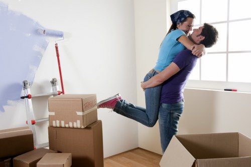 Household removals team handling boxes and furniture in Chiswick