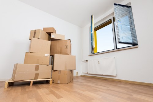 Careful unpacking of boxes in a Chiswick home after relocation
