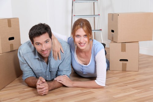 Professional movers loading boxes into a removal van in Chiswick