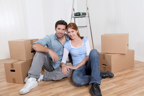 Movers carefully loading furniture for same day removals in Chiswick