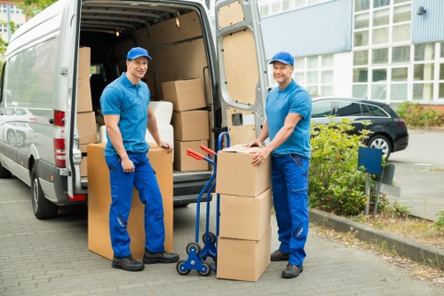 Man and van van loading boxes for a Chiswick move