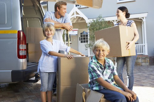 Packed boxes and moving supplies prepared for a Chiswick apartment move