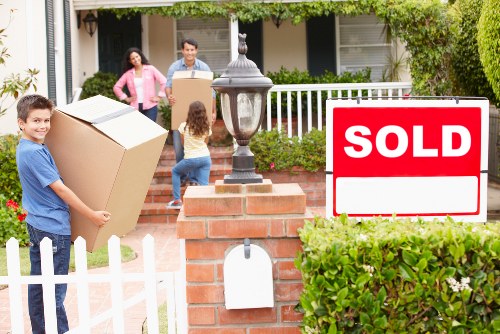 Packed moving boxes and furniture ready for removals in Chiswick