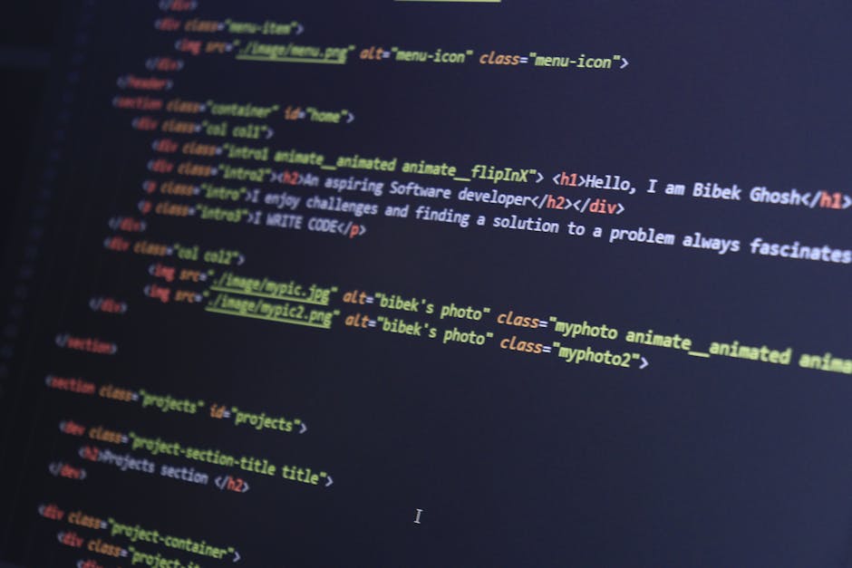 Close-up view of a computer screen displaying complex lines of code with multicolored syntax highlighting, including functions, variables, and tags, which may relate to logistics and moving software. 